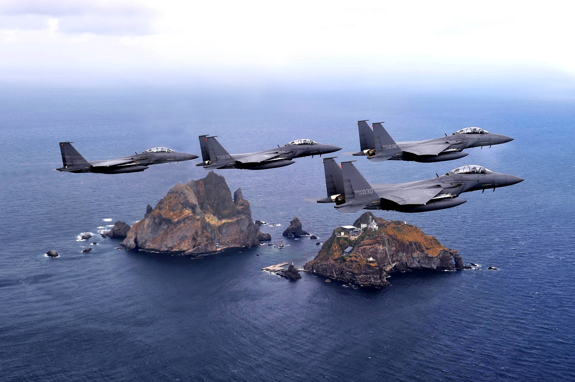 Four F-15Ks in formation above Dokdo in the East Sea