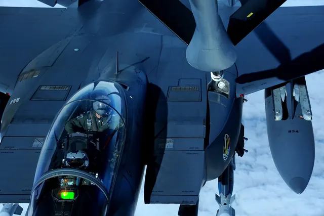 An F-15K seen from a tanker as the refuelling boom moves towards its receptacle