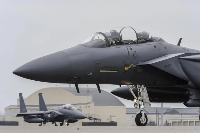 Close view of the forward fuselage of a taxiing F-15K with both crew in the cockpit