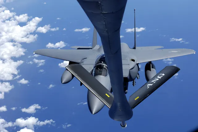 An F-15K in contact with a tanker refuelling boom, seen from the tanker